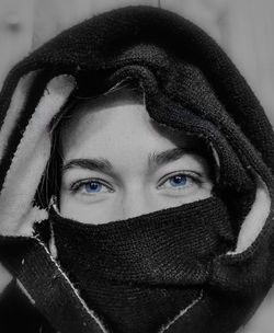 Close-up portrait of woman covering face