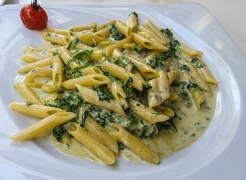 Close-up of spinach pasta in plate on table