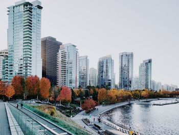 Buildings in city against clear sky