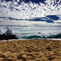 Scenic view of beach against sky