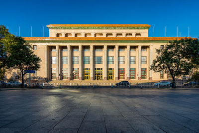 Facade of historical building against sky in city