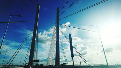 Low angle view of cables against blue sky