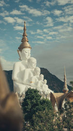 Statue of temple against sky