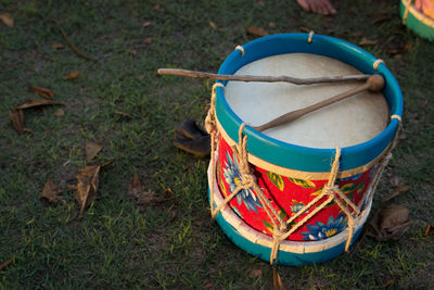 Handmade colorfull drum laying on the grass