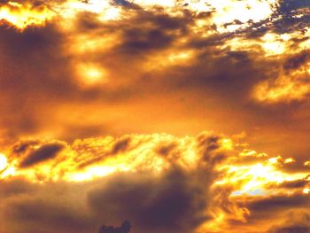 Low angle view of cloudy sky at sunset