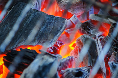 Firewood burning on barbecue grill