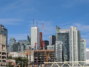 Modern buildings in city against sky