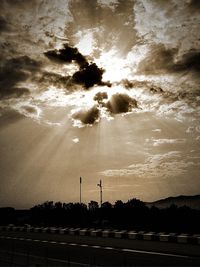 Road against sky at sunset