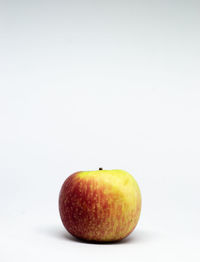 Close-up of apple against white background