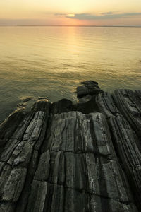 Scenic view of sea against sky at sunset