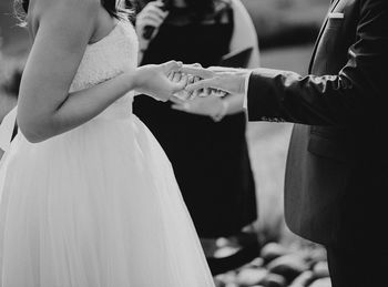 Close-up of couple holding hands