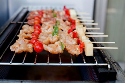 Close-up of meat on barbecue grill