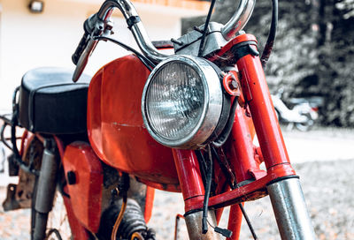 Close-up photo of vintage red motorcycle