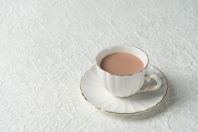 High angle view of coffee cup on table