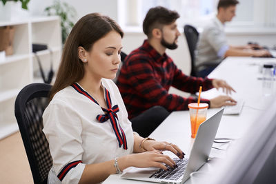 Young woman using laptop at home