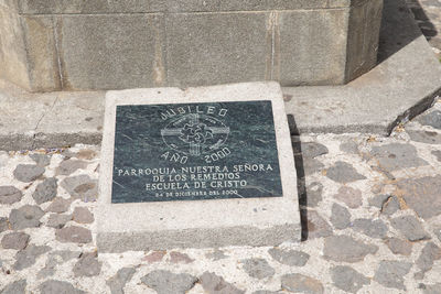 High angle view of text on stone wall