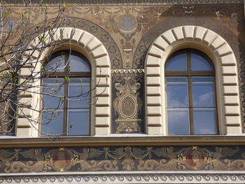 Low angle view of building seen through window