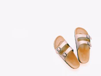 High angle view of shoes on floor against white background