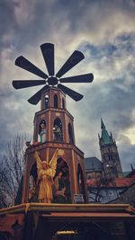 Low angle view of statue against sky