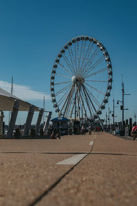 Ferris wheel against sky in city