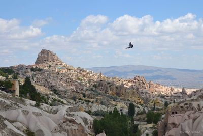Scenic view of mountain against cloudy sky