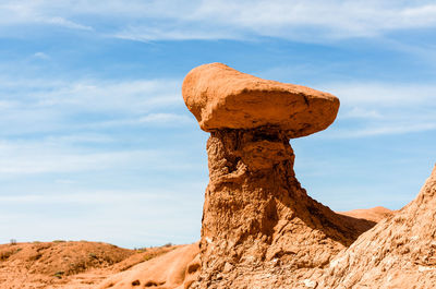 Rock hoodoo against sky