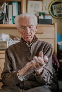 Portrait of man sitting at home