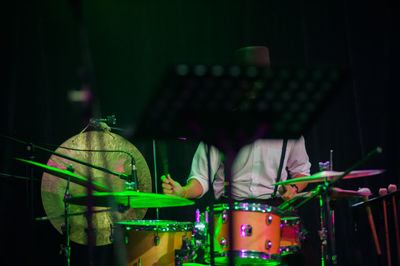 Man playing drums during concert