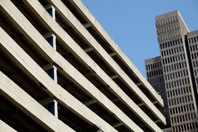 Low angle view of skyscrapers against clear sky