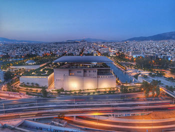 High angle view of illuminated buildings in city at night