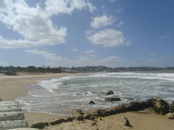 Scenic view of sea against cloudy sky