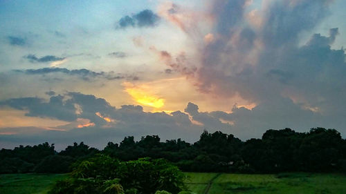 Scenic view of landscape against sky during sunset