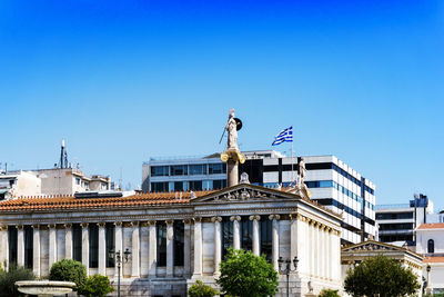 Low angle view of government building against clear blue sky