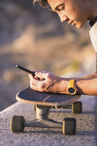 Close-up of man using mobile phone