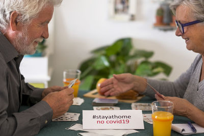 Couple playing cards at home