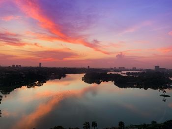 Scenic view of river against sky during sunset