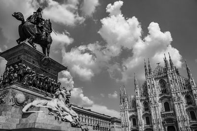 Low angle view of statue against sky in city