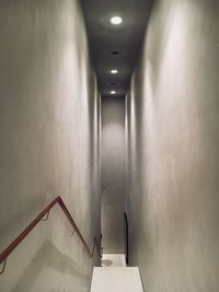 Staircase in illuminated corridor
