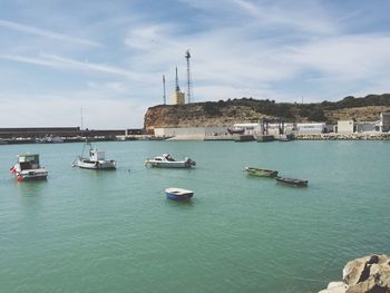 View of boats in calm blue sea