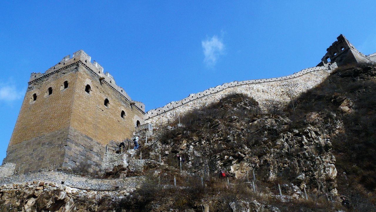 LOW ANGLE VIEW OF BUILDING AGAINST BLUE SKY