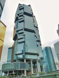 Low angle view of modern buildings against sky in city