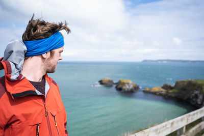 Man looking at sea against sky