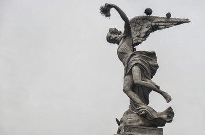 Low angle view of statue against clear sky