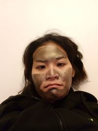 Portrait of man against wall