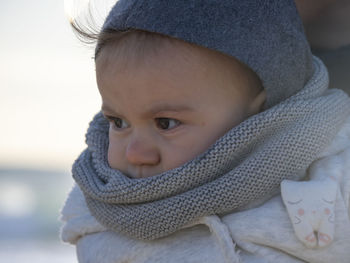 Close-up portrait of cute baby girl in winter