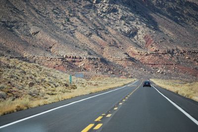 Country road leading towards mountains