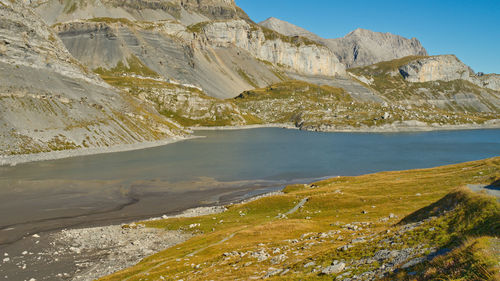 Scenic view of lake and mountains against sky