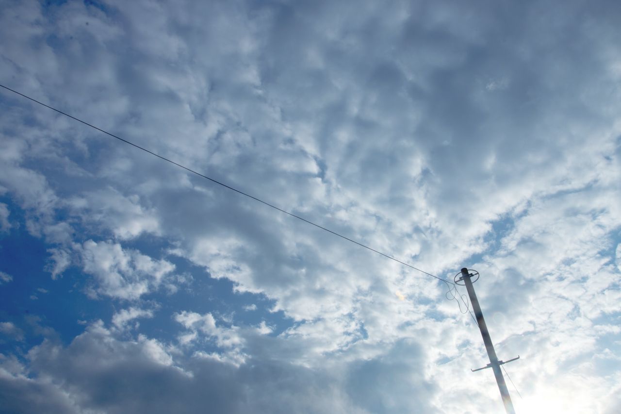 low angle view, sky, power line, cloud - sky, electricity, power supply, electricity pylon, cloudy, cable, connection, fuel and power generation, technology, cloud, nature, blue, beauty in nature, no people, outdoors, tranquility, silhouette