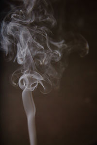 Close-up of smoke against black background