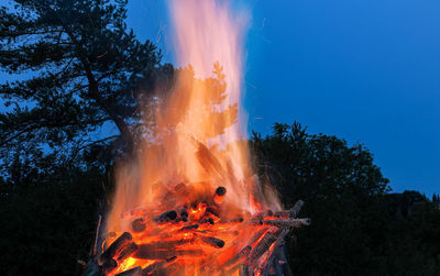 Bonfire on field against sky